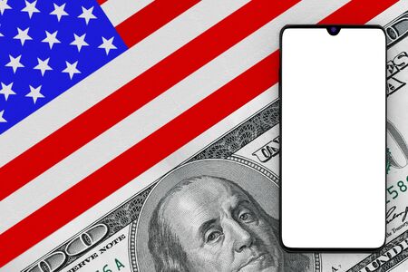 Mobile Phone with Blank Screen for Your Design over USA Flag with One Hundred Dollar Bill extreme...