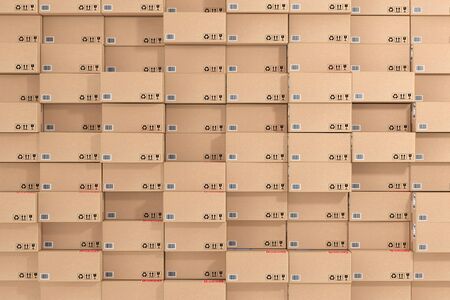 Logistic, Distribution and Delivery Concept. Cardboard Packages and Parcels Boxes Stack in Warehouse as Background extreme closeup. 3d Renderingの写真素材