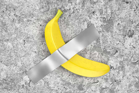 Single Ripe Yellow Banana Duct Taped to Concrete Wall extreme closeup. 3d Renderingの写真素材