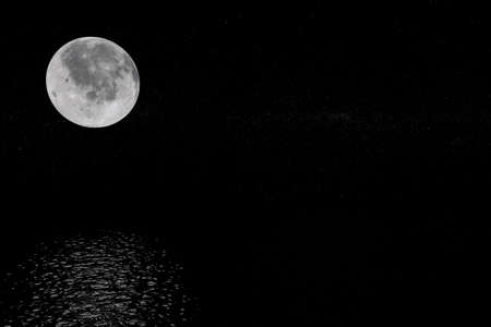 View of Full Big Super Moon from Space on a Black Sky Stars background. 3d Renderingの写真素材