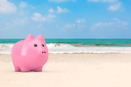 Pink Piggy Bank on the Ocean or Sea Sand Beach extreme closeup. 3d Renderingの写真素材