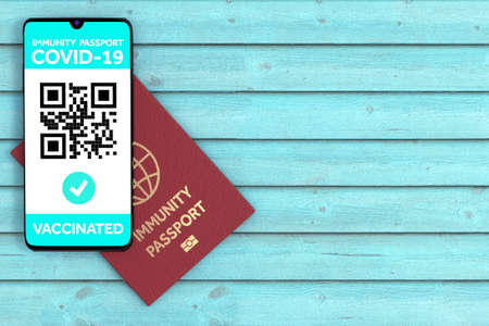 Mark Vaccinated Health Immune Passport Certificate of Vaccination App on Mobile Phone Screen with Abstract QR Code and Pass Check on a blue wooden background. 3d Renderingの写真素材