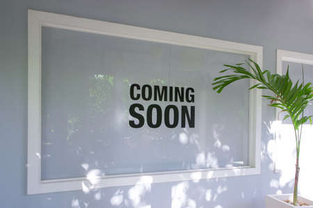 Shop Window with Coming Soon Sign extreme closeupの写真素材