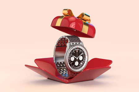 Luxury Classic Analog Man Wrist Silver Watch in Opened Red Gift Box with Golden Ribbon on a pink...