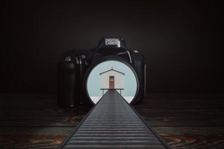 Fisherman's Minimalistic Sea House with a Wooden Pedestrian Bridget Comes Out of the Camera Lens on a black background. 3d Renderingの写真素材