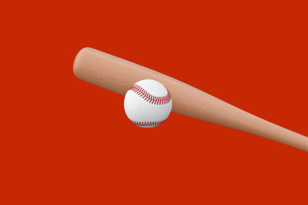 White Baseball Ball and Wooden Bat on a red background. 3d Renderingの写真素材