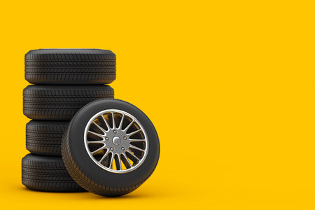 New Car Wheel Tires Pile on a yellow background.  3d Renderingの写真素材