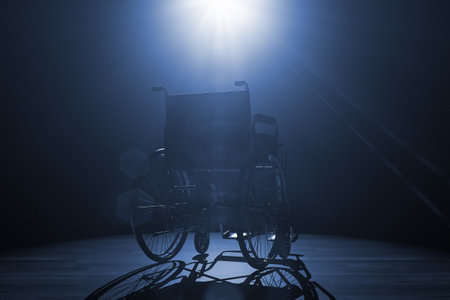 Back of Empty Wheelchair in Spotlight Lights on a black background. 3d renderingの写真素材