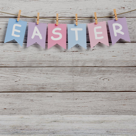 Easter Sign Hanging on Rope with Clothespins on a Plank Wooden background. 3d renderingの写真素材