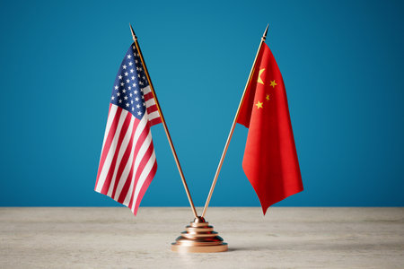 Global Diplomacy Concept. USA And China National Flags Crossed On Golden Stand Against Blue Background. 3d Renderingの写真素材
