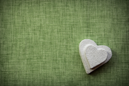 Heart made of paper mache on a fabric background, to be used for craftsの写真素材