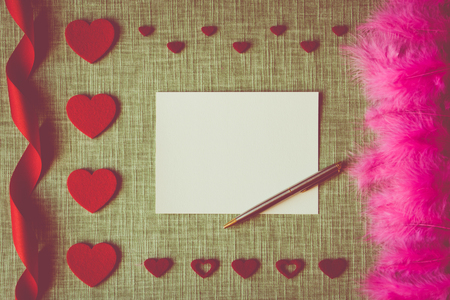 Valentine's Day card on fabric background with craft suppliesの写真素材