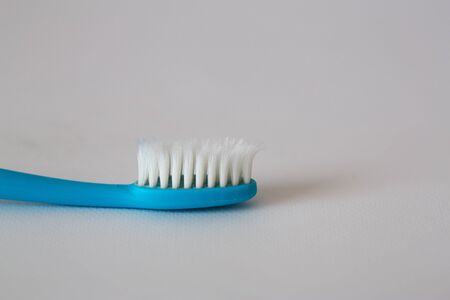 Old Tooth brush on white backgroundの写真素材