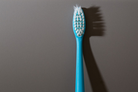 Old Tooth brush light and shadowの写真素材