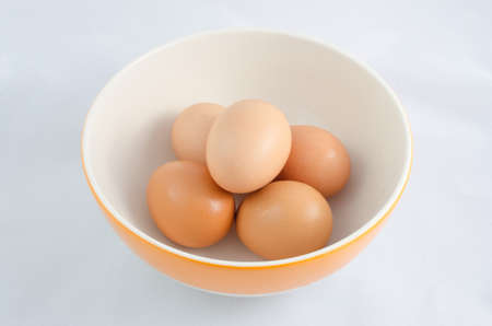 There are five eggs in the bowl