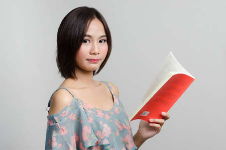 Girl reading and action with her books in leisure timeのeditorial素材
