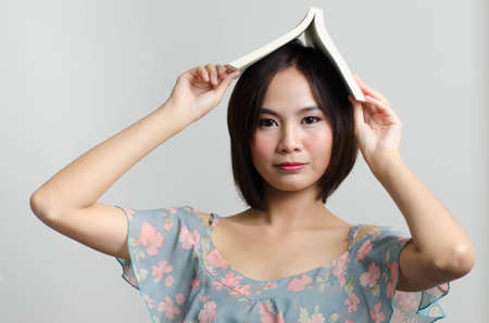 Girl reading and action with her books in leisure timeのeditorial素材