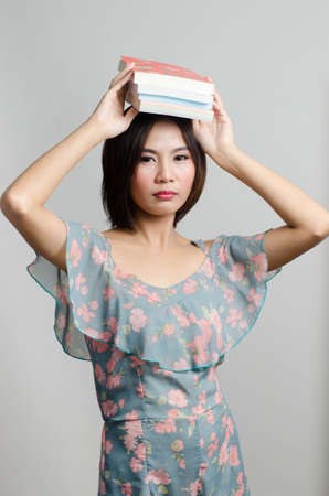 Girl reading and action with her books in leisure timeのeditorial素材