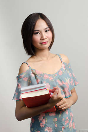 Girl reading and action with her books in leisure timeのeditorial素材