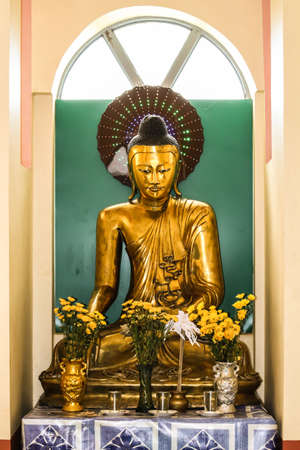 gold budha statue in myanmarの写真素材