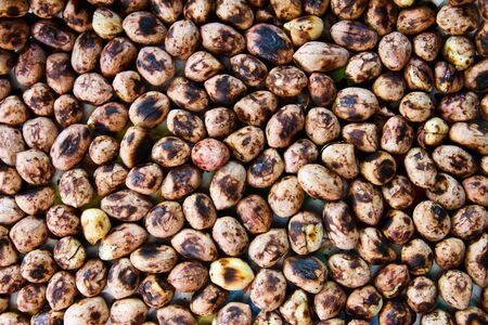 Background of a heap of roasted peanuts.の写真素材