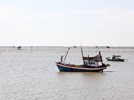 Wooden fishing boat on the sea.の写真素材