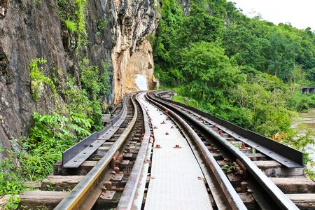 Dead railway beside cliff, along Kwai river in Thailandの写真素材