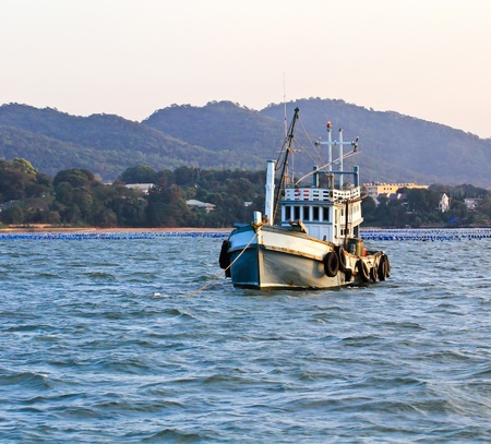 Wooden fishing boat on seaの写真素材