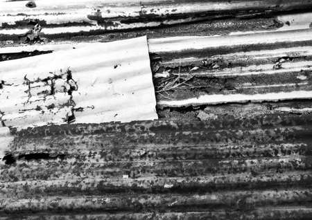 Old corrugated iron fence for background, black and white version.の写真素材