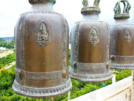 Temple bells hanged for everyone to ringed them for their own fortune at Thai temple, Thailand.の写真素材