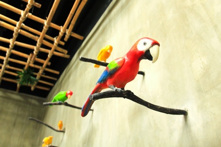 Bird sculpture colorful on wallの写真素材
