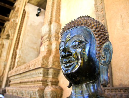 Bronze Buddha statue at the Haw Phra Kaew, Vientiane, Laos.の写真素材