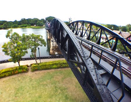 KANCHANABURI,THAILAND-AUGUST 28 : People taking photo with the running train on the bridge on the...