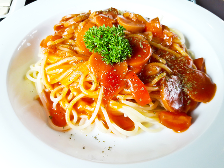 Spaghetti with tomato sauce and sausageの写真素材