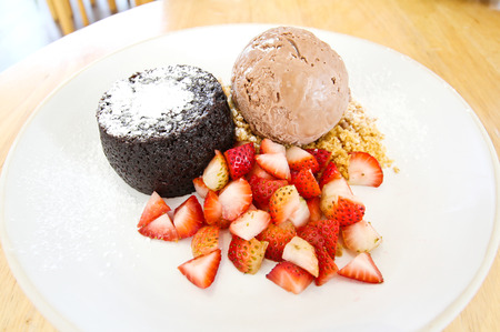 Chocolate lava with  ice cream and strawberryの写真素材