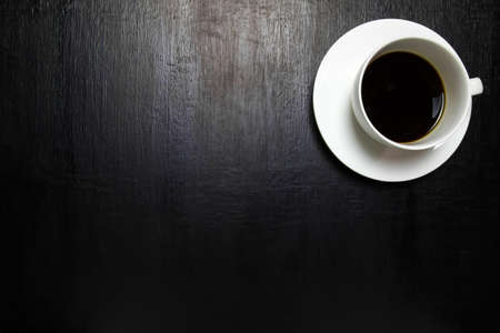 Cup of coffee on wooden table, top viewの写真素材