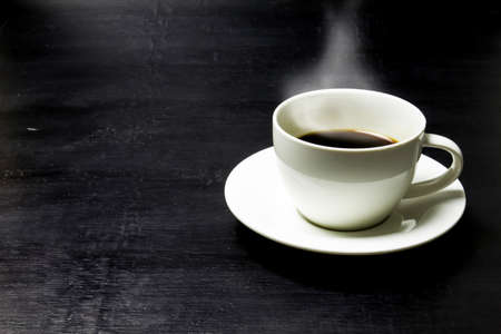Cup of coffee on a wooden tableの写真素材