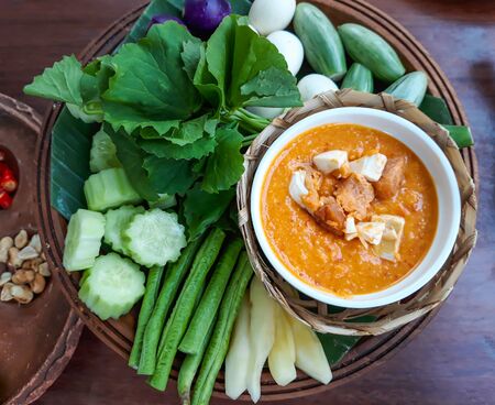 Salted egg chili dip with fresh vegetables, Thai food.