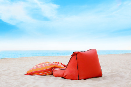 Red pillow on the beachの写真素材