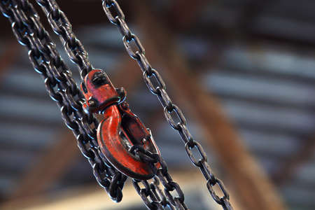 Chain and Red hoist on backgroundの写真素材