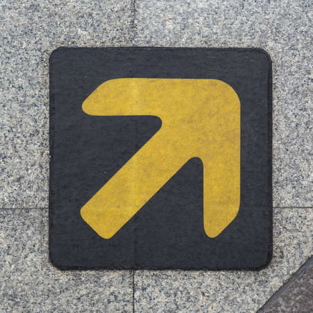 Yellow arrow on the groundの写真素材