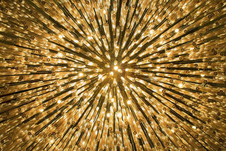 Abstract festive background - bright orange lights as starsの写真素材