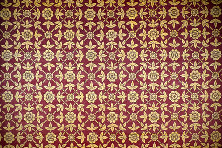 flower pattern in traditional Thai style art painting on window of the temple