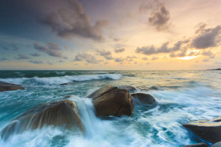 Rock and seascape at sunset time