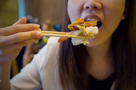 Eating japanese food as close-upの写真素材