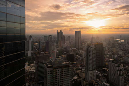 Aerial view of Bangkok modern office buildings, condominium, living place in Bangkok city downtown with sunset scenery, Bangkok is the most populated city in Southeast Asia.Bangkok , Thailandのeditorial素材