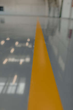 Epoxy and waxed flooring with colorful signage in car service