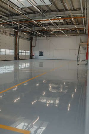 Epoxy and waxed flooring with colorful signage in car service