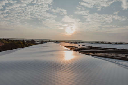 Water resistant tpo membrane positioned on the roof. PVC and rubber membrane. Sky