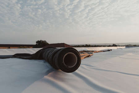 Roofing PVC membrane in rolls placed on the roof of the siteの写真素材